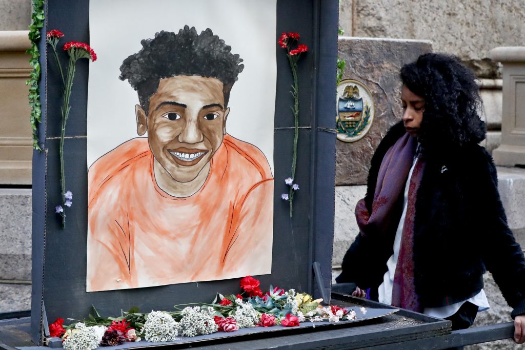 Pennsylvania Police Shooting A woman who did not want to be identified holds a memorial display with a drawing of Antwon Rose II in front of the court house on the first day of the trial for Michael Rosfeld, a former police officer in East Pittsburgh, last month. Rosfeld was acquitted in the fatal shooting of Antwon Rose II as he fled during a traffic stop on June 19, 2018. (Keith Srakocic/AP Photo)