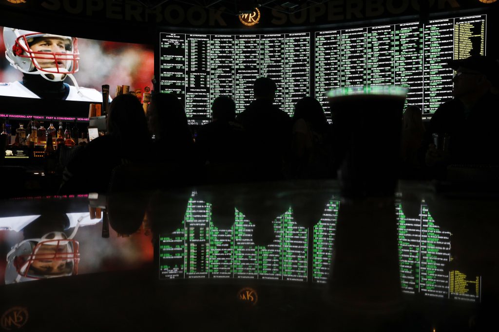 AP Poll Sports Betting About six in 10 Americans want betting on professional sports events to be legal in their state, but fewer feel that way about college athletics, according to a new poll conducted by The Associated Press-NORC Center for Public Affairs Research released Wednesday, March 20, 2019. (John Locher/AP Photo)
