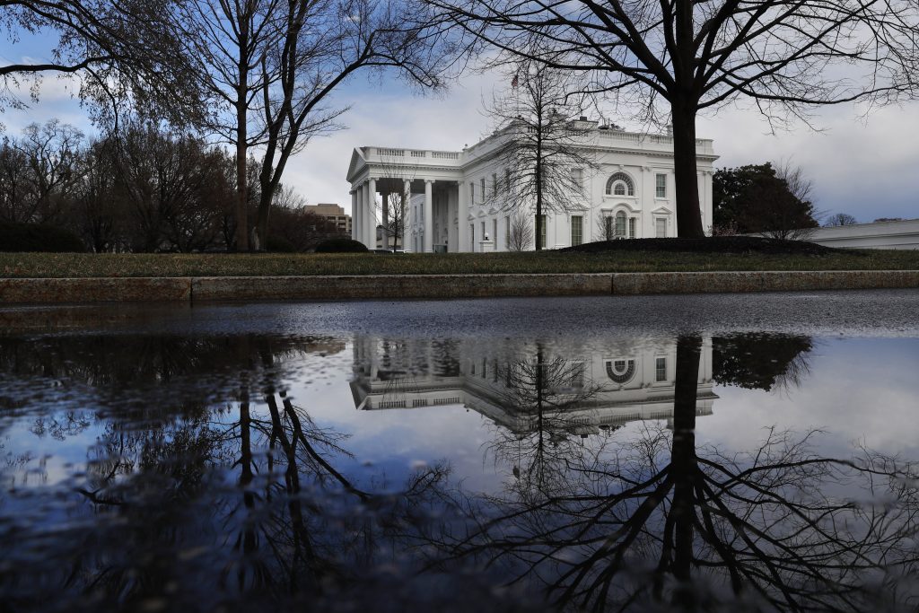 Trump Russia Probe Mueller The White House is reflected in a puddle, Friday March 22, 2019, in Washington, as news breaks that the special counsel Robert Mueller has concluded his investigation into Russian election interference and possible coordination with associates of President Donald Trump. (Jacquelyn Martin/AP Photo)