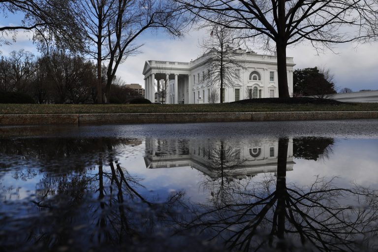The White House is reflected in a puddle, Friday March 22, 2019, in Washington, as news breaks that the special counsel Robert Mueller has concluded his investigation into Russian election interference and possible coordination with associates of President Donald Trump. (Jacquelyn Martin/AP Photo)