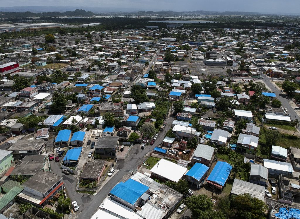 Congress Disaster Aide This June 18, 2018, file photo shows an aerial view of the Amelia neighborhood in the municipality of Catano, east of San Juan, Puerto Rico. (Dennis M. Rivera/AP Photo)