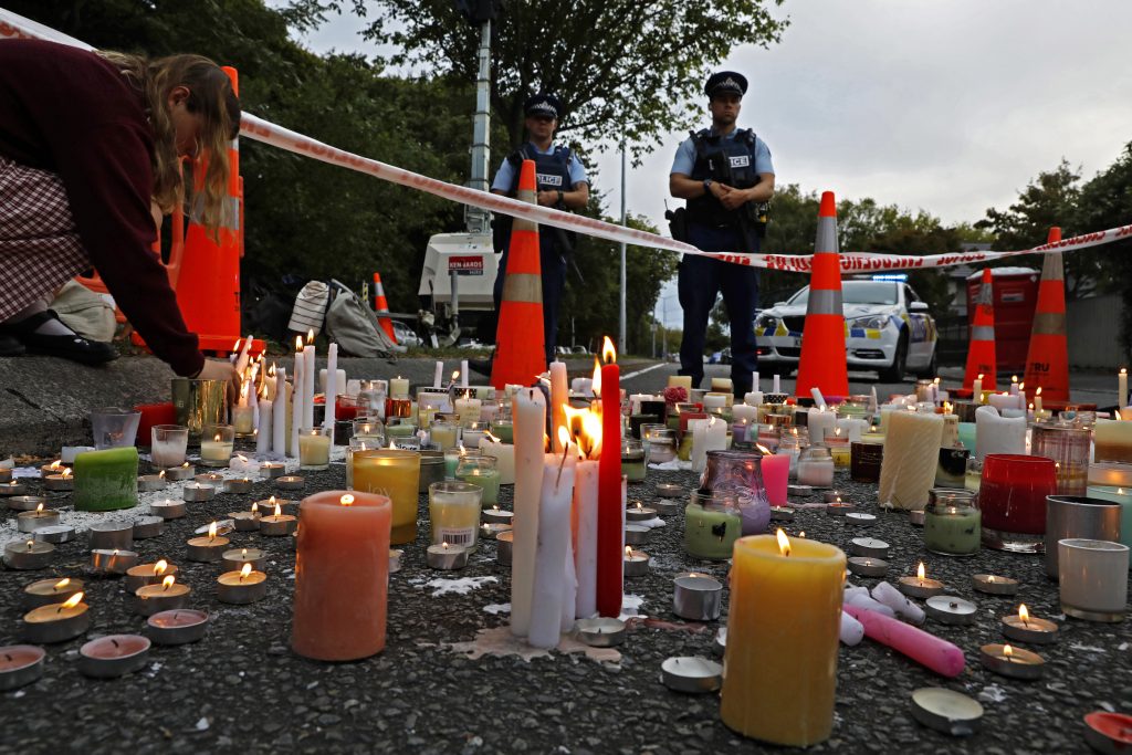 New Zealand Mosque Shooting Free Speech In this March 18, 2019, file photo, a student lights candle during a vigil to commemorate victims of March 15 shooting, outside the Al Noor mosque in Christchurch, New Zealand. New Zealanders are debating the limits of free speech after their chief censor banned a 74-page manifesto written by a man accused of massacring 50 people at two mosques. (Vincent Yu/AP Photo)