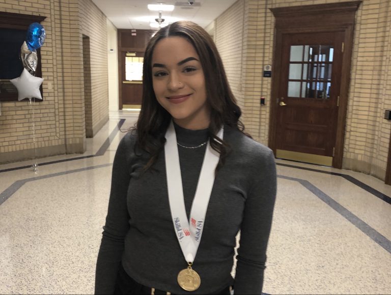 Aiyana Branch, who wants to be a hair stylist and salon owner, won a first place award for her skills demo. (Cris Barrish/WHYY)