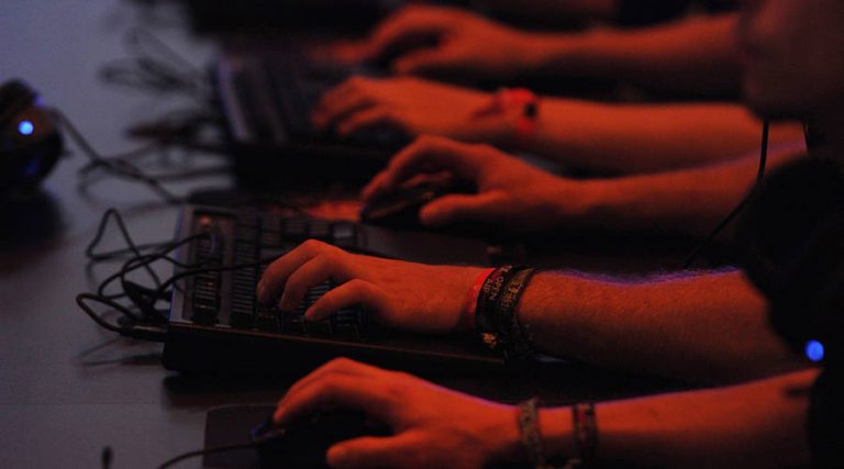 Computer gamers play in front of their screens on August 18, 2011. (Patrik Stollarz/AFP/Getty Images)
