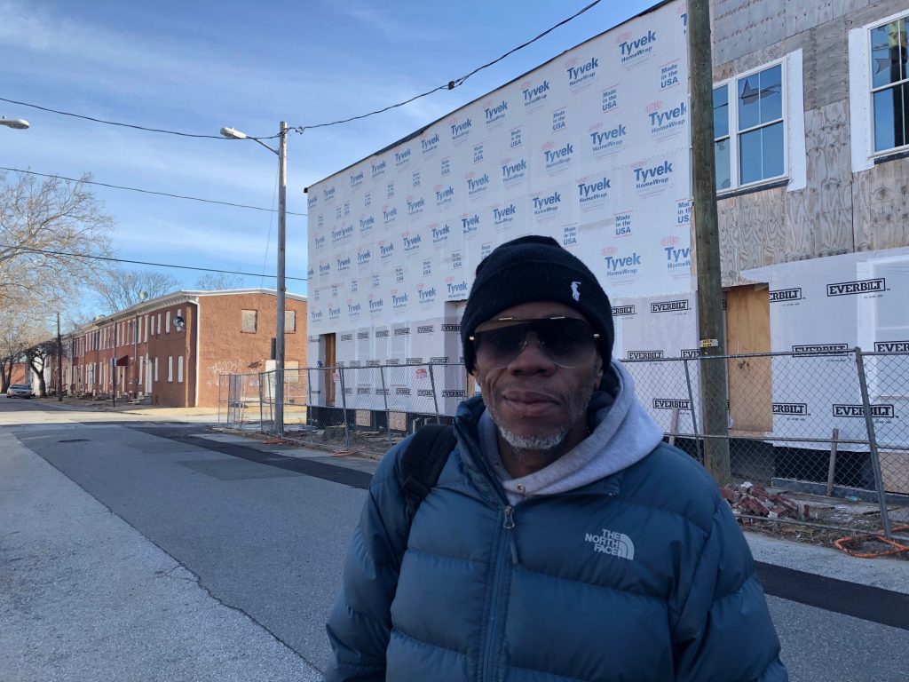 IMG_1799 Troy Curtis calls it a “waste of money” that homes being built and slated for renovation on Wilmington’s East Side have languished without progress for months. (Cris Barrish/WHYY)