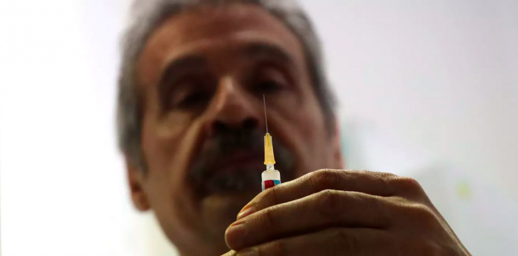 Screen Shot 2019-03-09 at 1.54.04 PM Dr. Roberto Ieraci prepares to vaccinate a child in Rome on Feb. 23, 2018. (Alessandro Tarantino/AP Photo)
