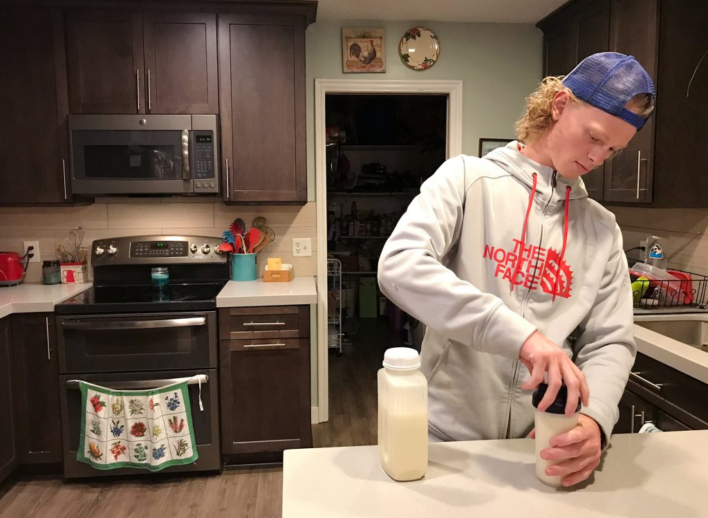 Jonah Reeder prepares a special protein shake that helps him manage a metabolic condition called phenylketonuria. Jonah Reeder prepares a special protein shake that helps him manage a metabolic condition called phenylketonuria. (Julia Ritchey/KUER)