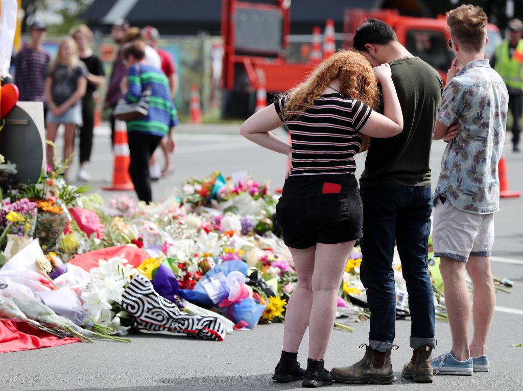 Residents pay their respects by placing flowers for the victims of the mosques attacks in Christchurch. Residents pay their respects by placing flowers for the victims of the mosques attacks in Christchurch. (Michael Bradley/AFP/Getty Images)
