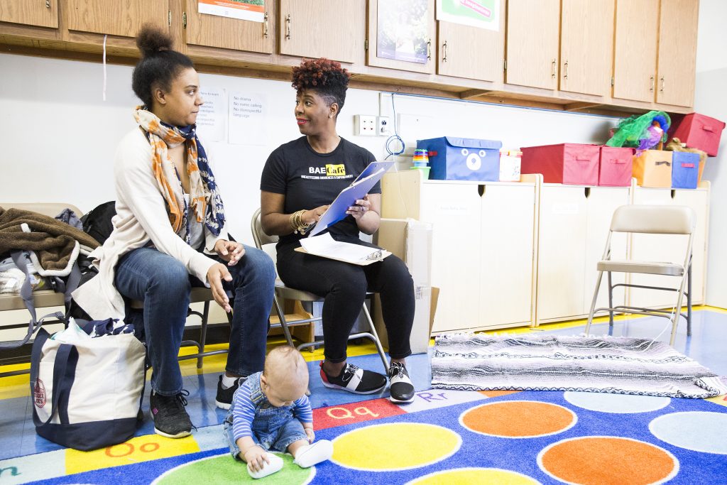 HE1POSTPARTUMXXP Jabina Coleman (right) introduces herself to Pamela Newman and 3-month-old James at the Lucien E. Blackwell library. Coleman leads a breastfeeding class and co-runs the Prenatal Mental Health Alliance for Women of Color. In February, some mothers described experiencing postpartum depression. (Rachel Wisniewski/ For the Philadelphia Inquirer)
