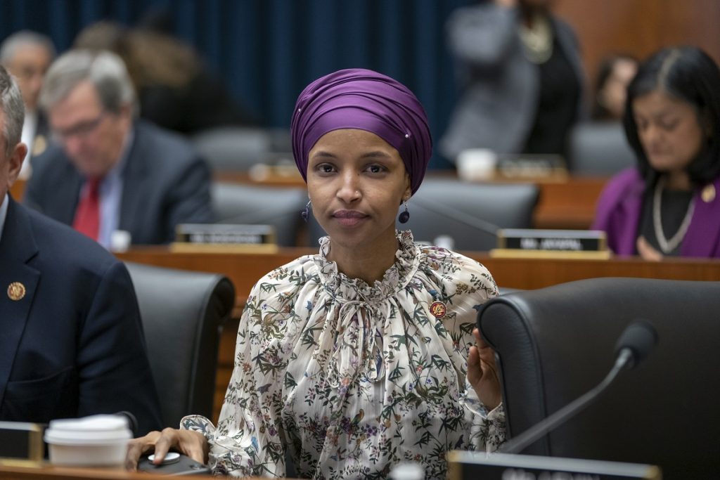 Ilhan Omar Rep. Ilhan Omar, D-Minn., sits with fellow Democrats on the House Education and Labor Committee during a bill markup, on Capitol Hill in Washington, Wednesday, March 6, 2019. Omar stirred controversy last week saying that Israel's supporters are pushing U.S. lawmakers to take a pledge of