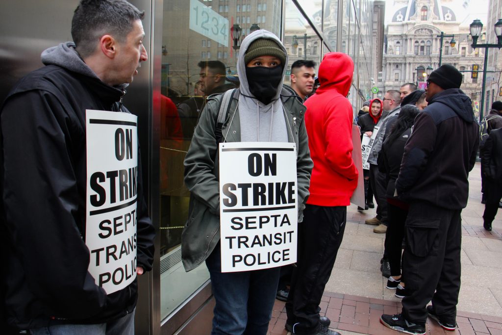 image_uploaded_from_ios About 30 SEPTA police officers picket outside SEPTA headquarters at 1234 Market Street. (Emma Lee/WHYY)