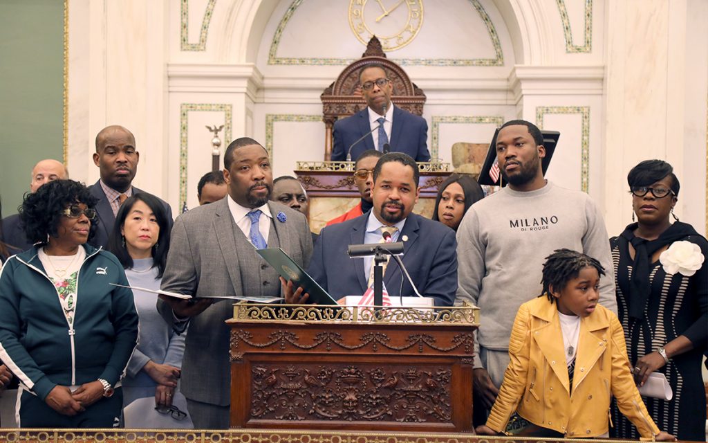 meek mill 1 Meek Mill (right) and his son listen as Pennsylvania state Sen. Sharif Street (center) presents a state resolution in his honor. (Tom MacDonald/WHYY)