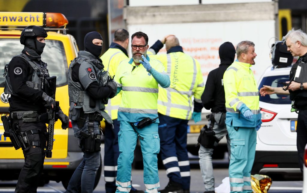 Police and emergency personnel stand at the 24 Oktoberplace intersection in Utrecht, where a shooting took place Monday. Several people were wounded in a shooting on a tram in the Dutch city. Police and emergency personnel stand at the 24 Oktoberplace intersection in Utrecht, where a shooting took place Monday. Several people were wounded in a shooting on a tram in the Dutch city.