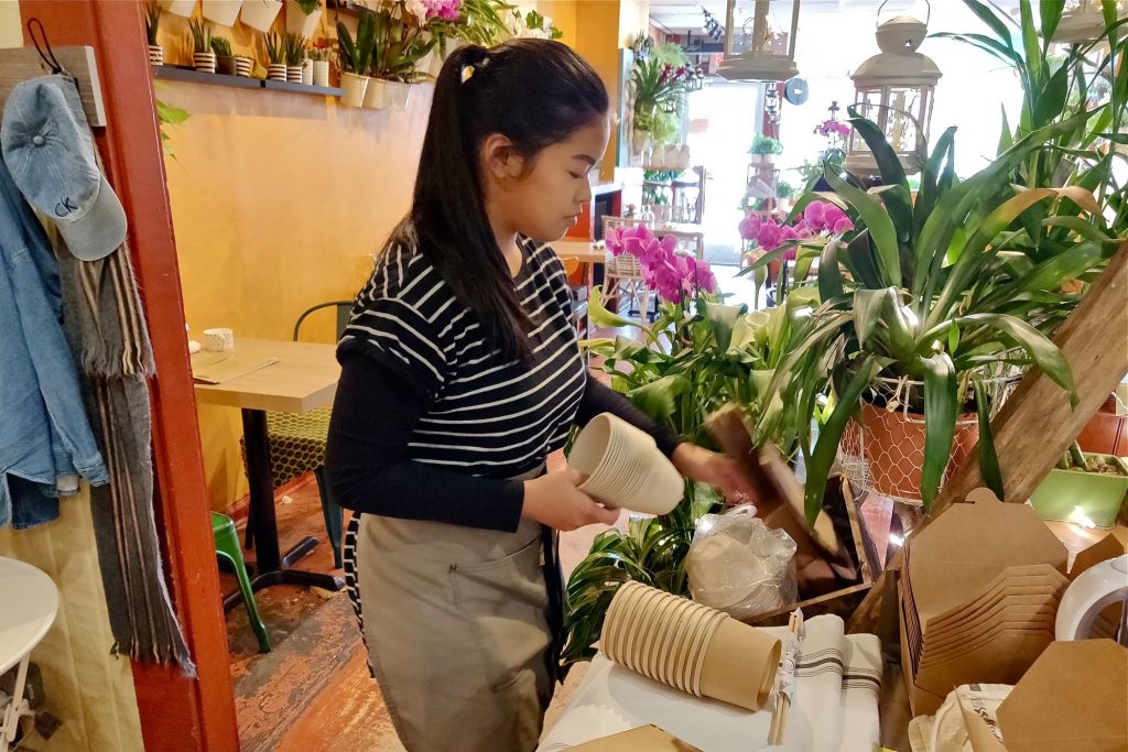 2019 03 03-x lopez-narberth-straw ban An employee at the Coco Thai Bistro lays out some of the shop's new biodegradable products. (Xavier Lopez for WHYY)