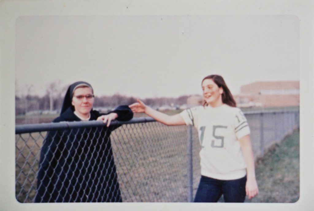 Patricia Cahill (right) greets Sister Eileen Shaw, the nun she says sexually abused her, at an event at Paramus Catholic High School in 1970. (Courtesy of Patricia Cahill)