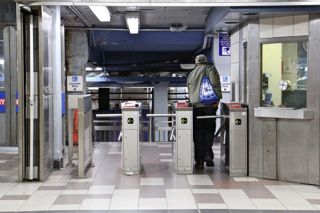 2019 04 02-e lee-philadelphia market frankfort 8th street septa-turnstiles A SEPTA rider passes through the turnstile at the 8th and Market station. (Emma Lee/WHYY)