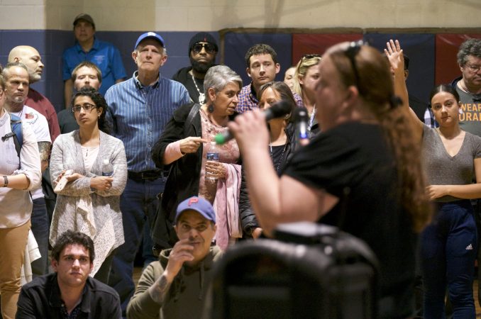 Representatives of Safehouse respond residents who voiced their questions and concerns over plans for a supervised injection facility during a community meeting at the Heitzman Rec Center on Thursday night. (Bastiaan Slabbers for WHYY)