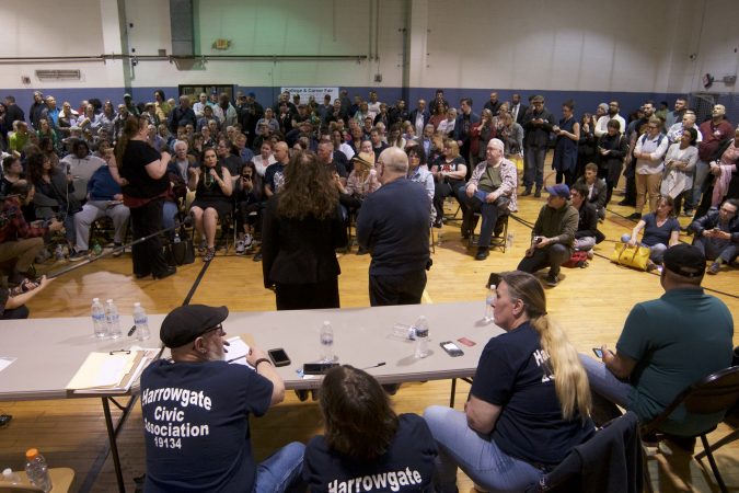 Representatives of Safehouse respond to questions and concerns about plans for a supervised injection facility in the neighborhood during a community meeting at the Heitzman Rec Center on Thursday night. (Bastiaan Slabbers for WHYY)