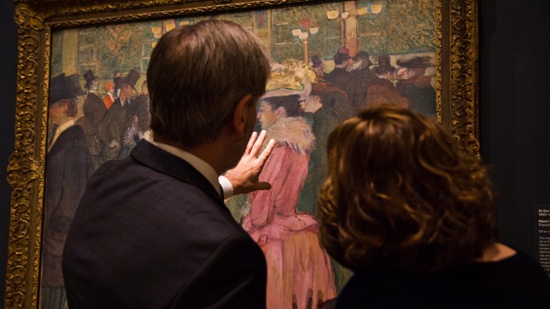 Visitors admire Henri de Toulouse-Lautrec’s “At the Moulin Rouge, The Dance” at “The Impressionist’s Eye” exhibit at the Philadelphia Museum of Art. (Kimberly Paynter/WHYY)