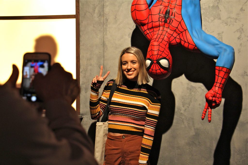 2019 04 12-e lee-philadelphia franklin institute-marvel comics exhibit A visitor to the Franklin Institute's Marvel Comics exhibit poses for a photo with a life-size Spider-Man figure. The exhibit promises to be a crowd pleaser, with a quarter million visitors expected through the summer. (Emma Lee/WHYY)