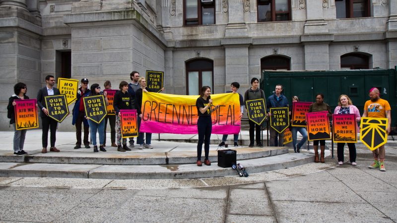 Supporters of the Green New Deal gathered outside City Hall Monday to demand Philadelphia City Council consider environmental justice in the city. (Kimberly Paynter/WHYY)