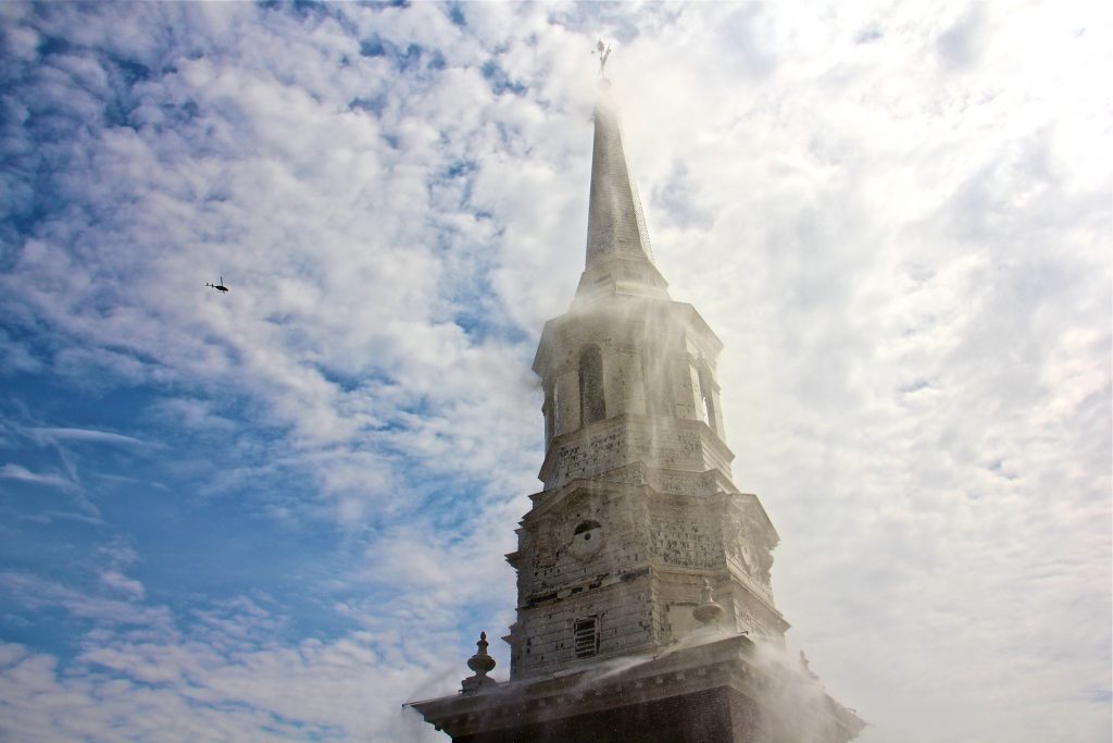 2019 04 17-e lee-philadelphia old city christ church-fire protection spire The spire of Christ Church in Od City fades behind a cascade of water, part of a fire protection system installed to prevent the kind of calamity that occured at Notre Dame cathedral in Paris. (Emma Lee/WHYY)