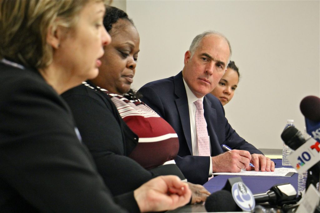 2019 04 26-e lee-bob casey-philadelphia upenn-violence against women discussion U.S. Sen. Bob Casey takes notes during a discussion at Penn's School of Social Policy and Practice about the importance of reauthorizing the Violence Against Women Act, which expired 70 days ago. (Emma Lee/WHYY)