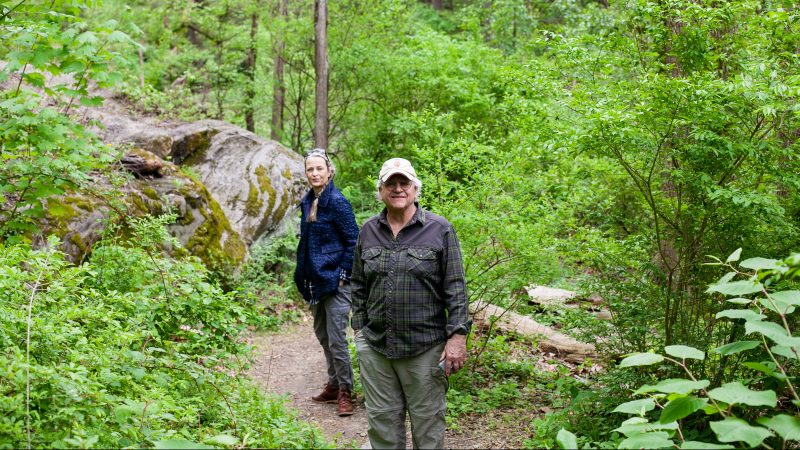Craig Johnson of Interpret Green and Helena Van Fliet of Bio Philly are pictured in Wissahickon Valley Park during the City Nature Challenge Sunday. (Brad Larrison for WHYY)