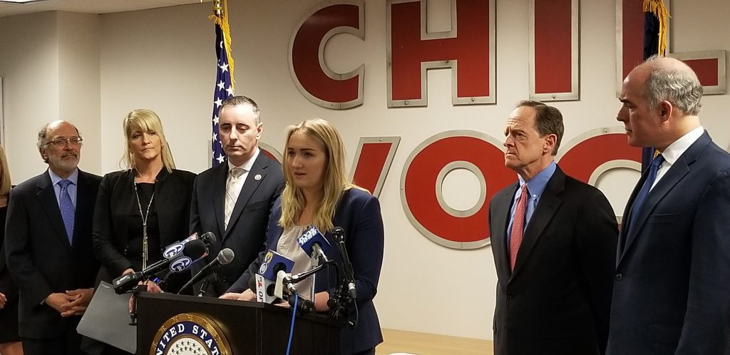 20190401_133139 Madison Zezzo, center, speaks about the Combat Online Predators Act flanked by U.S. Rep. Brian Fitzpatrick (left) and U.S. Sens. Pat Toomey and Bob Casey (right). (Tom MacDonald/WHYY)