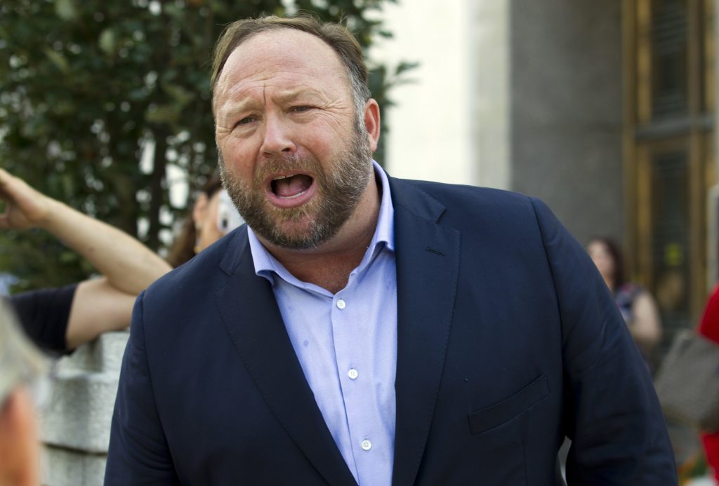 PayPal-Alex Jones Infowars' Host Alex Jones was forcibly deposed under oath on March 14 by the lawyer of Sandy Hook parents, and the entire proceeding — more than three hours long — was posted online last Friday. (Jose Luis Magana/AP Photo)