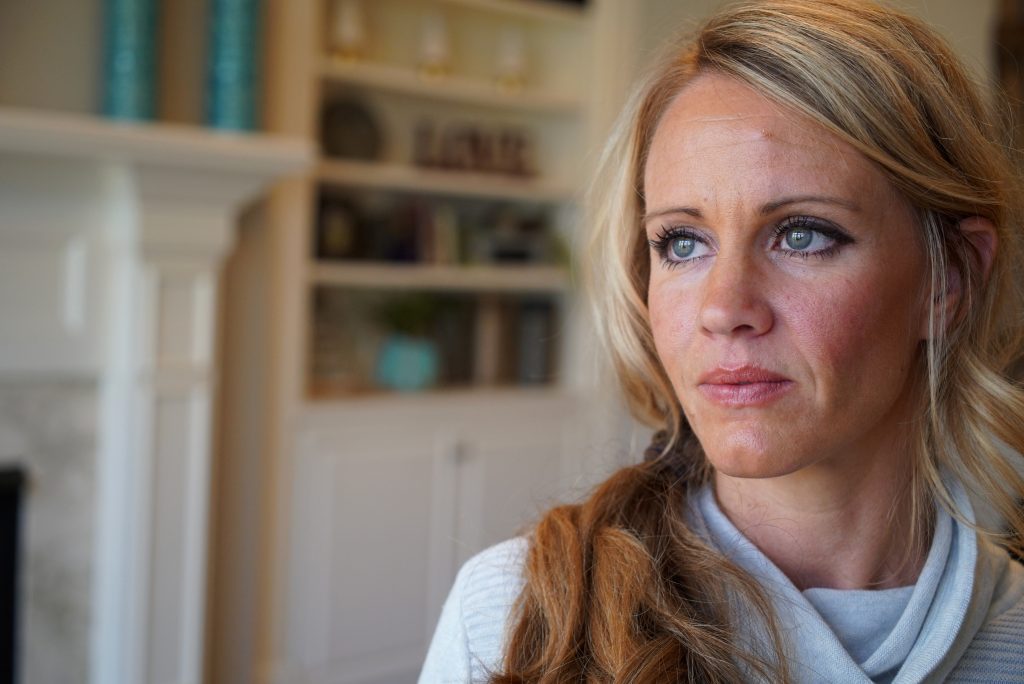 Columbine 20 Years Later In this March 27, 2019, photo, Kacey Ruegsegger Johnson poses for a portrait at her home in Cary, N.C. Ruegsegger Johnson, now a mother of four, survived a shotgun blast during the 1999 shootings at Colorado's Columbine High School that left 12 students, one teacher, and both gunmen dead. (Allen G. Breed/AP Photo)