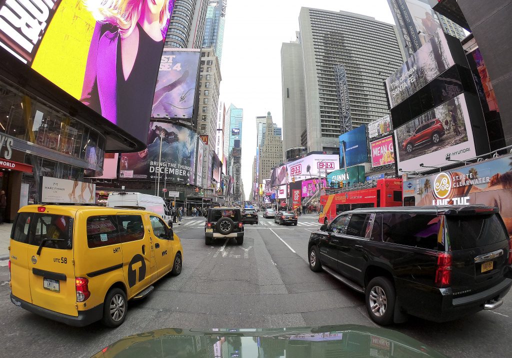 Manhattan Tolls Motorists roll south on 7th Avenue in Times Square, Friday, March 29, 2019, in New York. Long ringed by some of the most expensive toll roads in the U.S., New York City is poised to take things even further with a plan to use automated license plate readers to charge drivers who motor into the most congested parts of Manhattan during times when crosstown traffic is at its worst.(AP Photo/Julie Jacobson)