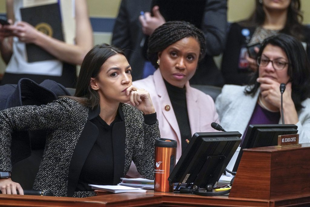 Alexandria Ocasio-Cortez, Ayanna Pressley, Rashida Tlaib Rep. Alexandria Ocasio-Cortez, D-N.Y., (left), joined by Rep. Ayanna Pressley, D-Mass., and Rep. Rashida Tlaib, D-Mich., listens during a House Oversight and Reform Committee meeting, on Capitol Hill in Washington, Tuesday, Feb. 26, 2019. House Democrats are rounding the first 100 days of their new majority taking stock of their accomplishments, noting the stumbles and marking their place as a frontline of resistance to President Donald Trump. (J. Scott Applewhite/AP Photo)