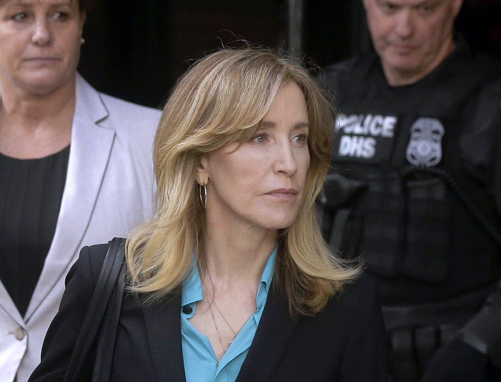 Felicity Huffman In this April 3, 2019 file photo, actress Felicity Huffman arrives at federal court in Boston to face charges in a nationwide college admissions bribery scandal. In a court filing on Monday, April 8, 2019, Huffman agreed to plead guilty in the cheating scam. (Steven Senne/AP Photo)