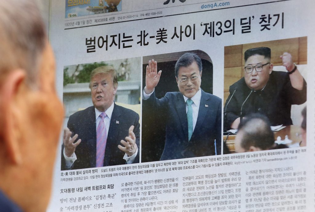 Moon Jae-in, Kim Jong Un, Donald Trump A man reads a newspaper showing photos, from left of U.S. President Donald Trump, South Korean President Moon Jae-in and North Korean leader Kim Jong Un in Seoul, South Korea, last week. North Korea test-fired a