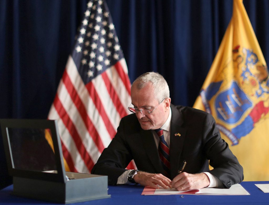 New Jersey Right to Die Law In this photo provided by the New Jersey Office of the Governor, N.J. Gov. Phil Murphy signs the Medical Aid in Dying for the Terminally Ill Act Friday, April 12, 2019 at the New Jersey Statehouse in Trenton, N.J. (New Jersey Office of the Governor via AP)