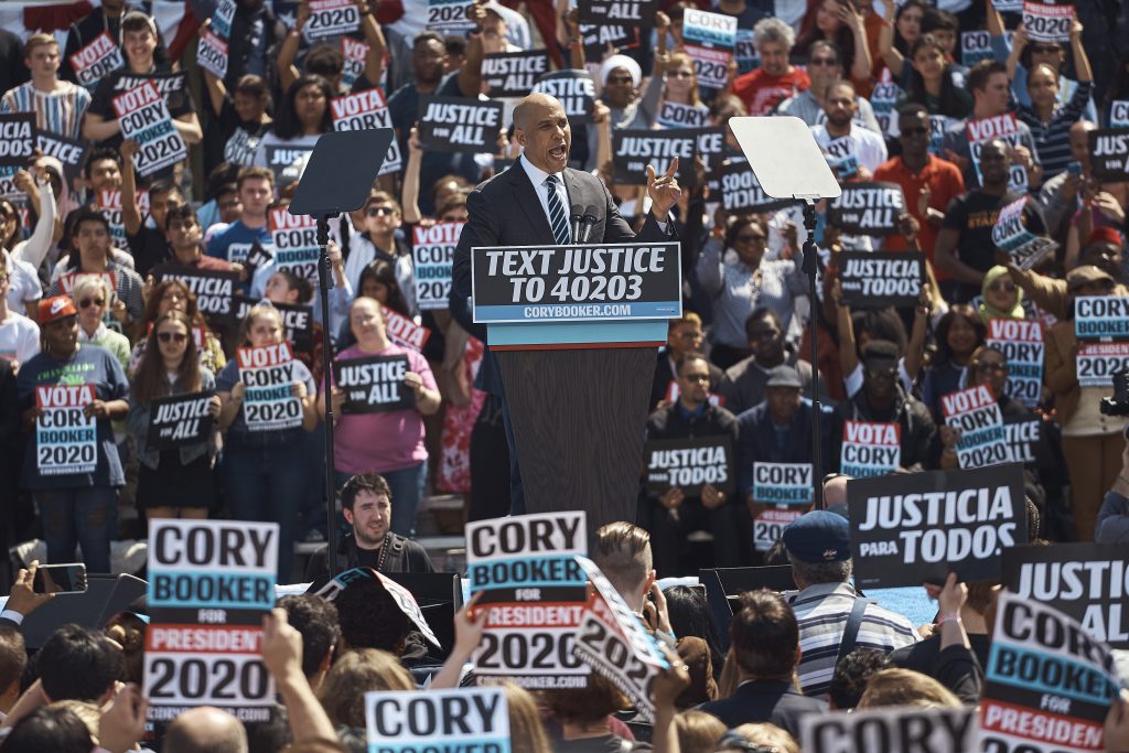 APTOPIX Election 2020 Cory Booker Democratic presidential candidate Sen. Cory Booker, D-N.J. talks to the crowd during a hometown kickoff for his national presidential campaign tour at Military Park in downtown Newark, Saturday, April 13, 2019. (Andres Kudacki/AP Photo)
