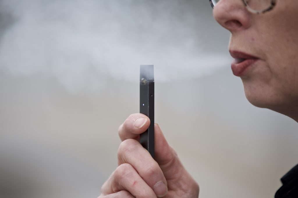 Juul Nicotine Chantel Williams exhales a puff of vapor from a Juul pen in Vancouver, Wash., Tuesday, April 16, 2019. (Craig Mitchelldyer/AP Photo)