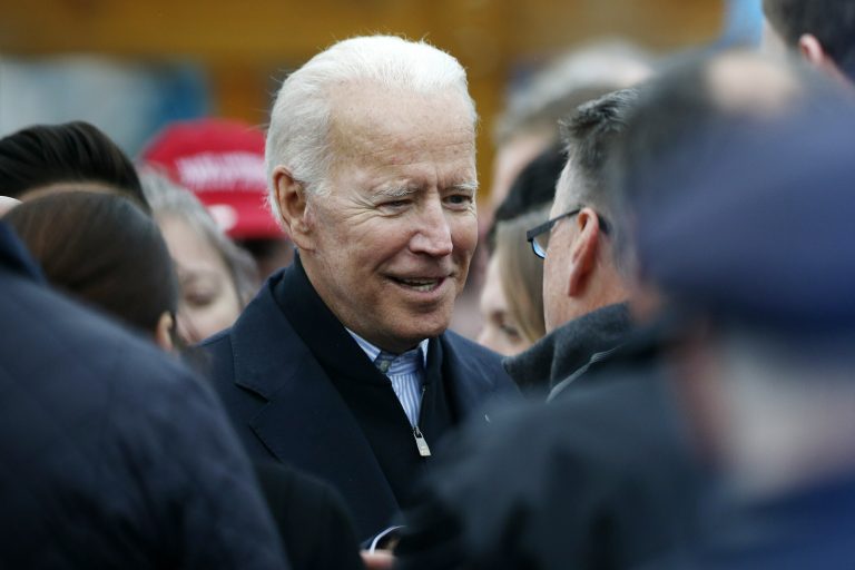 Former vice president Joe Biden talks with officials after speaking at a rally in support of striking Stop & Shop workers in Boston, Thursday, April 18, 2019. (Michael Dwyer/AP Photo)