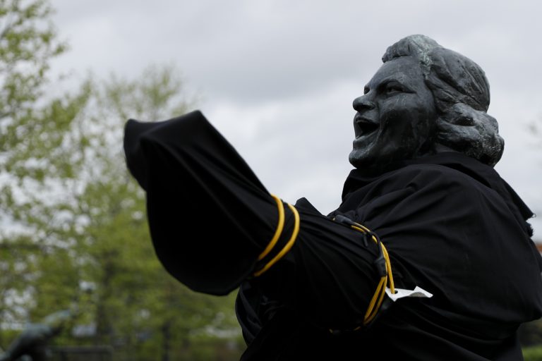 A partially covered statue of singer Kate Smith is seen near the Wells Fargo Center, Friday, April 19, 2019, in Philadelphia. (Matt Slocum/AP Photo)