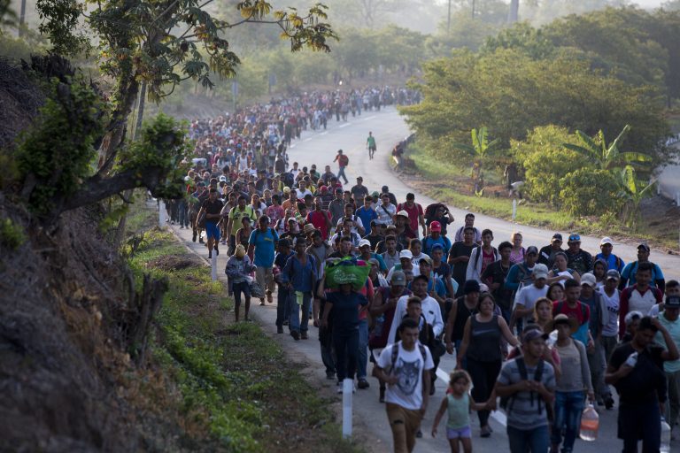 Central American migrants, part of a caravan hoping to reach the U.S. border, move on the road in Escuintla, Chiapas State, Mexico, Saturday, April 20, 2019. Thousands of migrants in several different caravans have been gathering in Chiapas in recent days and weeks. (Moises Castillo/AP Photo)