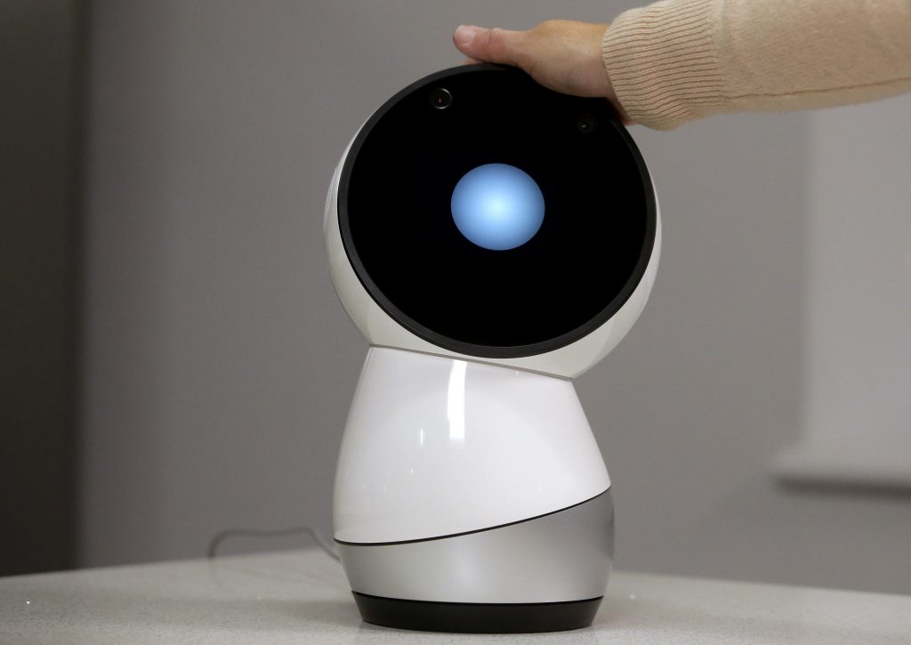 Cynthia Breazeal FILE - In this Nov. 21, 2017, file photo Massachusetts Institute of Technology professor and robotics researcher Cynthia Breazeal reaches to touch social robot Jibo at the company's headquarters in Boston. When robots move like humans and talk like humans, even if only a little bit, it’s natural that we will treat them more like humans. (Steven Senne/AP Photo, File)