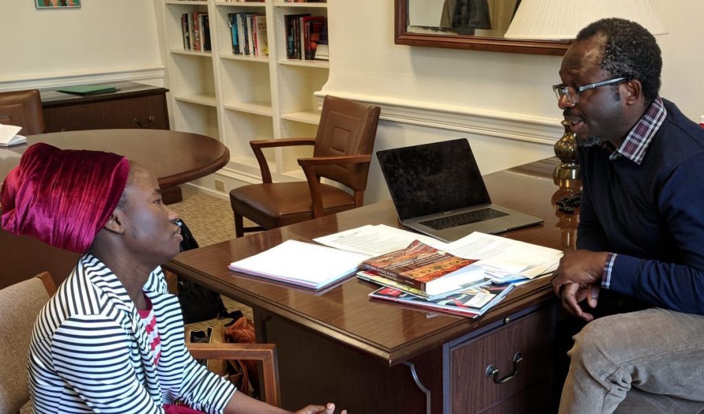 IMG_20190410_111834-e1555345474562-1920×725 Patience Bulus speaks with Professor Jacob Udo-Udo Jacob in his office at Dickinson College. (Rachel McDevitt/WITF)