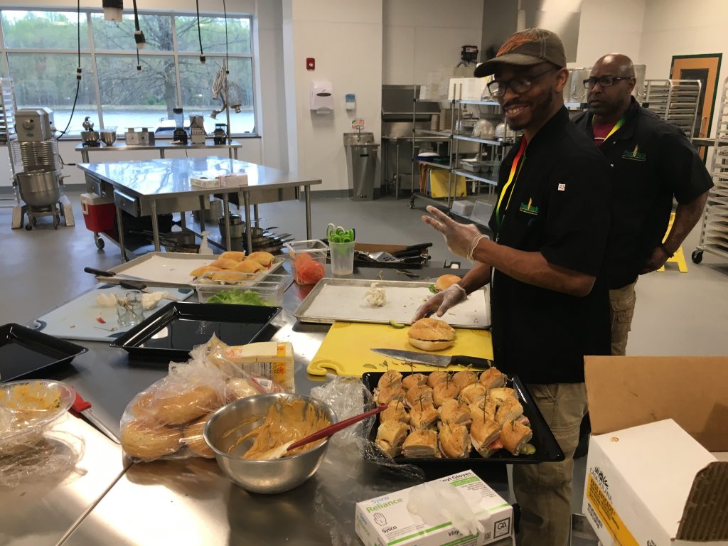 IMG_3547 Food Bank workers prepare lunch inside the industrial kitchen at the new facility in Glasgow. The kitchen will be used for training in the expanded culinary program. (Mark Eichmann/WHYY)