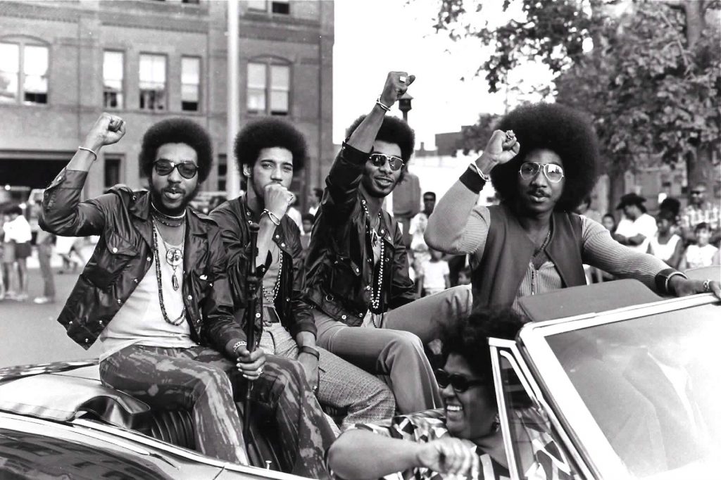 NTR Press Photo 2 Members of the Nat Turner Rebellion ride in a parade during a Harambe Festival in Springfield, Mass., in the early 1970s. Pictured from left are Major Harris, Ron Hopper, Bill Stratley, and Joe Jefferson. (Courtesy of Reservoir Media)