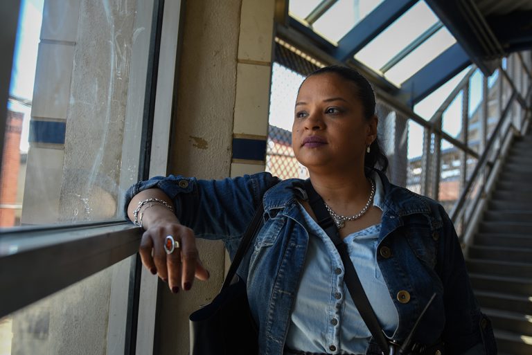 News-Feature-April-3-768×513 Roz Pichardo looks out the window at Kensington Avenue from inside the Somerset El station on April 27, 2019. Pichardo is a Kensington resident who works in the harm reduction community in the neighborhood. (Erin Blewett/Kensington Voice)