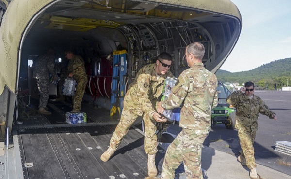 PA_national_guard_harvey2 Pennsylvania National Guard Soldiers load bottled water onto a CH-47 Chinook helicopter September 1 at Fort Indiantown Gap in preparation to depart for the Hurricane Harvey relief effort in Texas. (U.S. National Guard photo by Sgt. Zane Craig)