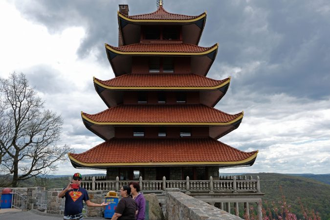 Visitors look out onto the city from Reading's famous Pagoda. (Matt Smith for WHYY)
