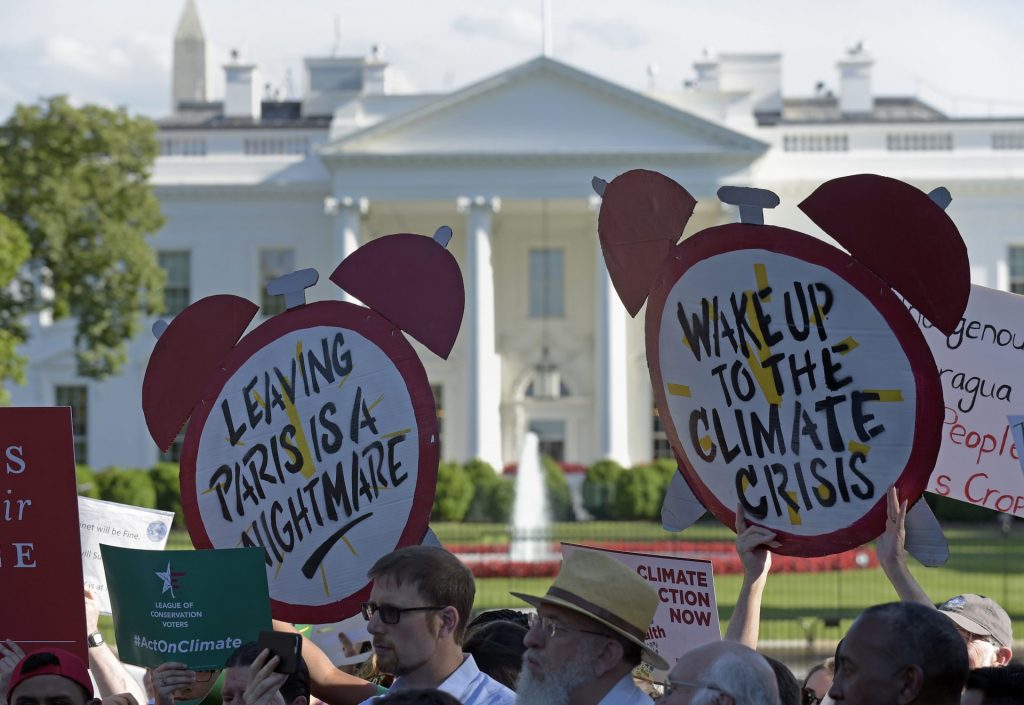 Trump-climate-protest-1920×1322 Protesters gather outside the White House in Washington, Thursday, June 1, 2017, to protest President Donald Trump's decision to withdraw the Unites States from the Paris climate change accord. (Susan Walsh/AP Photo)