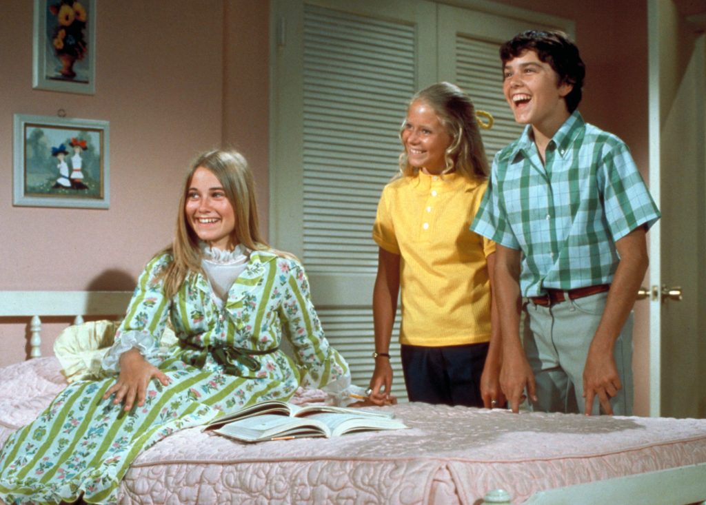 The Brady Bunch, circa 1970, with oldest sister Marcia seated in front. In one episode of the show from 1969, the sisters and brothers all stay home from school with measles. The Brady Bunch, circa 1970, with oldest sister Marcia seated in front. In one episode of the show from 1969, the sisters and brothers all stay home from school with measles. (ABC Photo Archives/Getty Images)